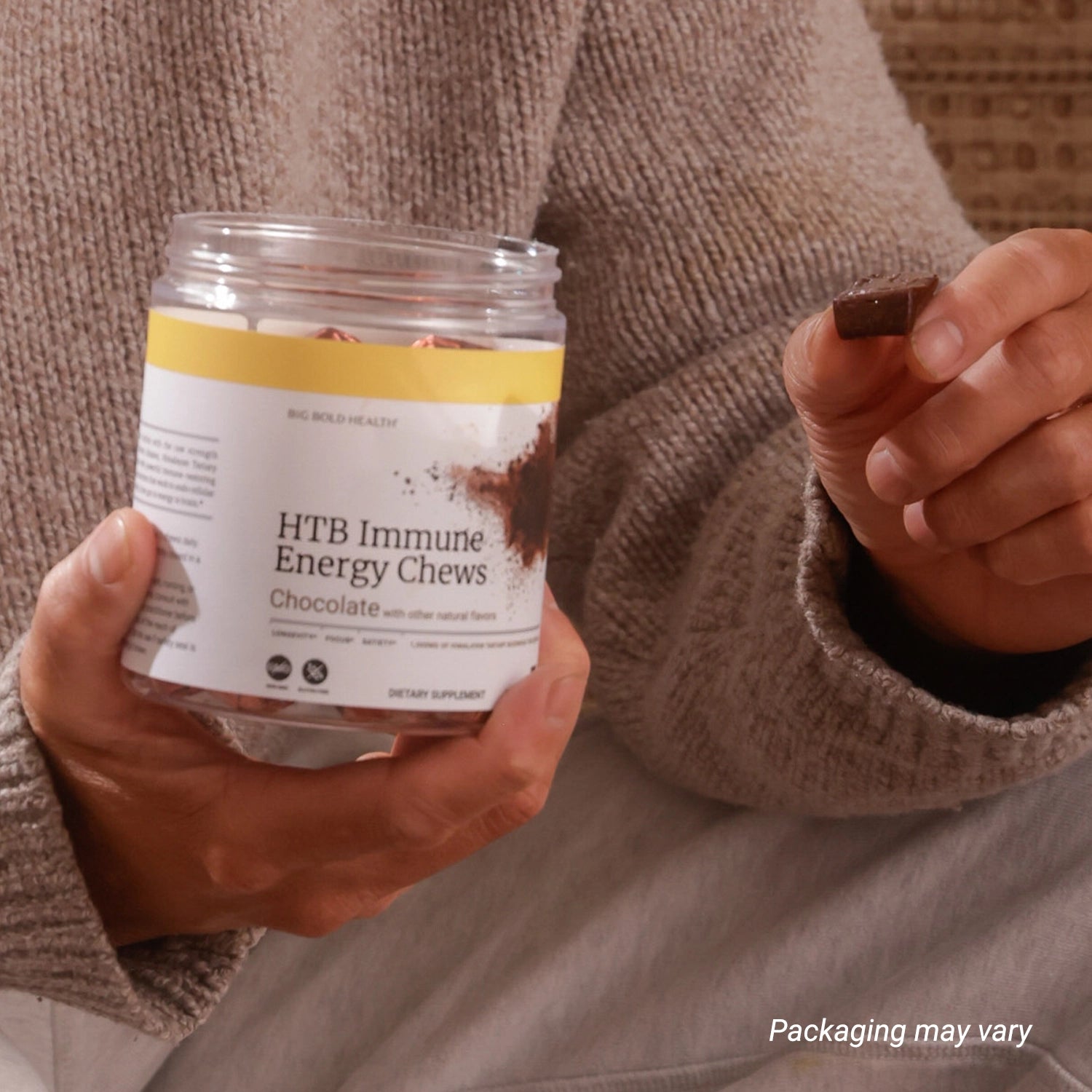 HTB Rejuvenate supplement bottle with capsules and wooden backdrop.