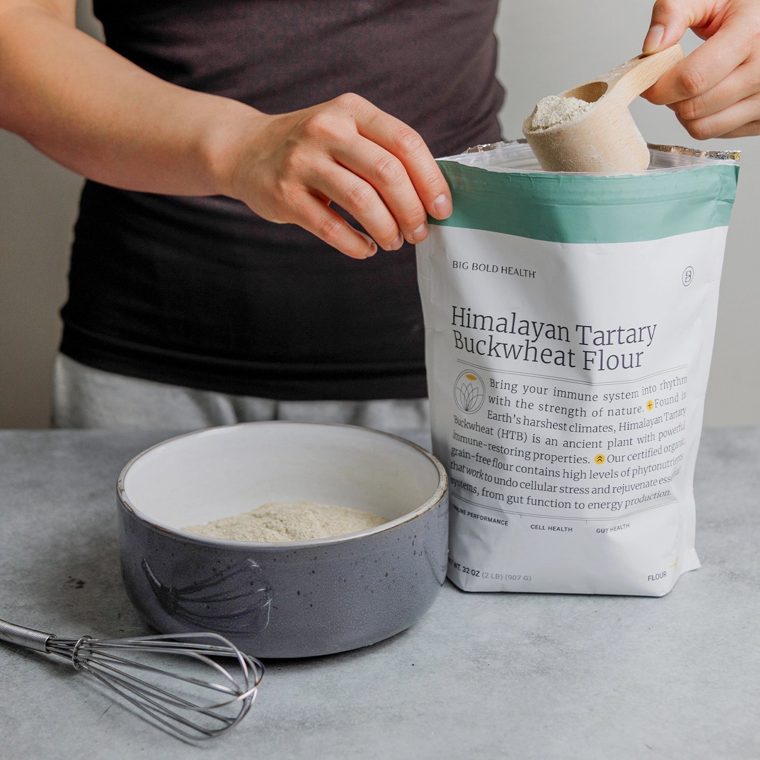 HTB Rejuvenate supplement bottle with capsules and wooden backdrop.