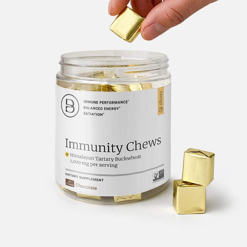 HTB Rejuvenate supplement bottle with capsules and wooden backdrop.