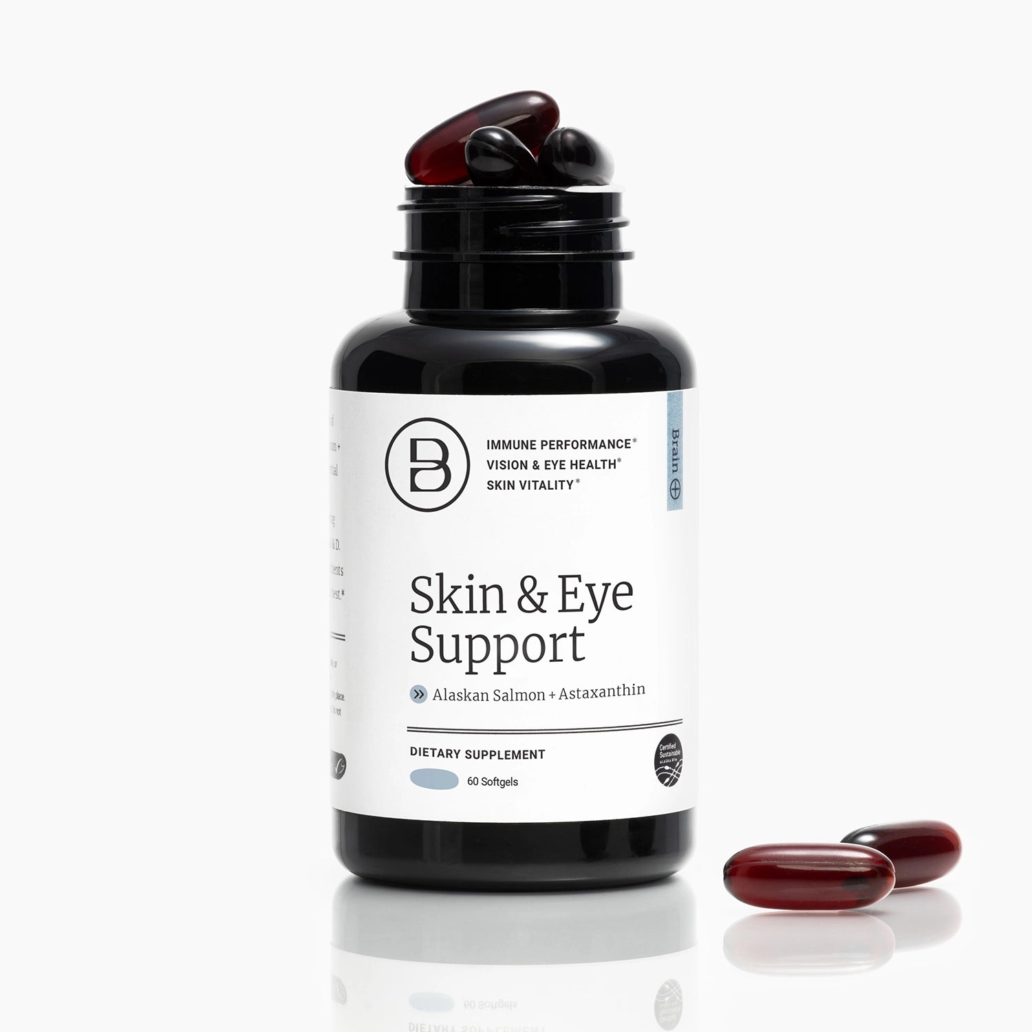 HTB Rejuvenate supplement bottle with capsules and wooden backdrop.